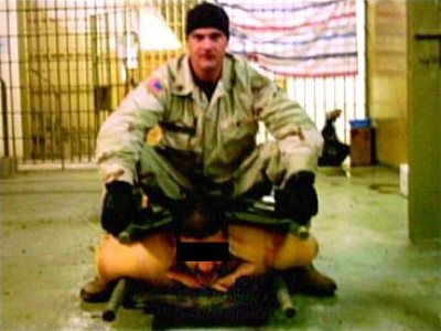 Ivan Frederick abusing an Iraqi prisoner.